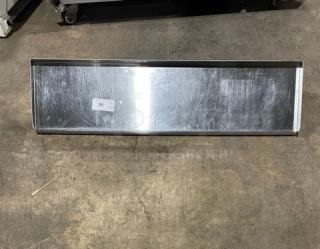 Commercial stainless steel rectangular wall-mount shelf, reflective finish, pre-owned. Label reads '95'.