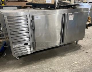 Traulsen stainless steel 2-door undercounter refrigerator, model UC2HT, with pan slide, chrome rack, on legs. Serial T276920J98.