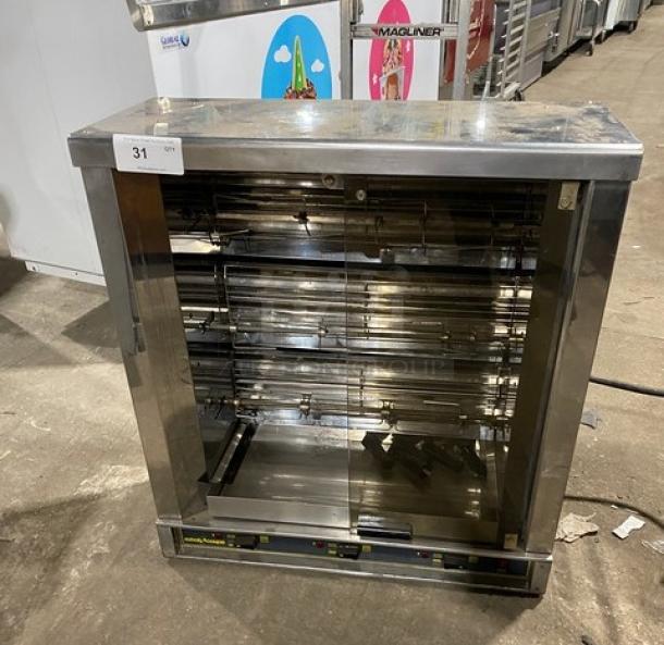 Robot Coupe commercial stainless steel electric countertop rotisserie cabinet with legs; good condition, model details visible.