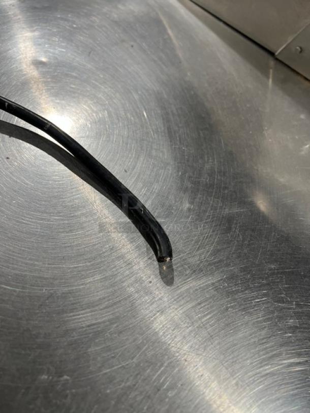 Continental SW48N8 stainless steel surface detail, showing part of a refrigerated prep table in good condition.