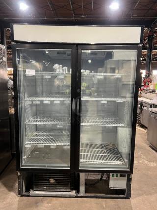 Maxx Cold commercial black double glass swing door reach-in merchandiser freezer, model MXM2-48F, with poly coated wired racks.