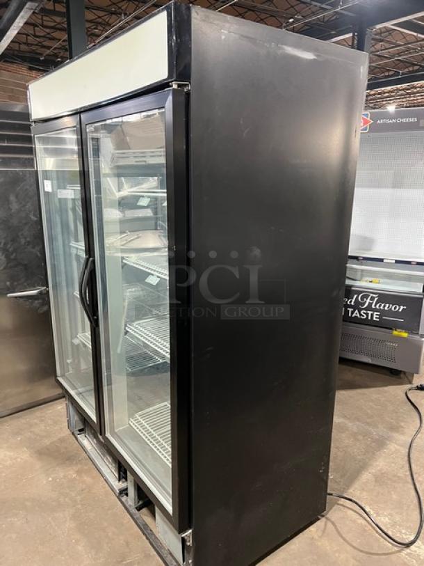 Maxx Cold black double glass door merchandiser freezer, model MXM248F, with poly coated wired racks, clean condition.