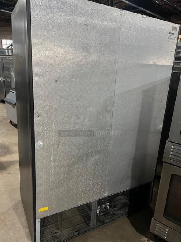 Maxx Cold commercial freezer, Model MXM2-48F, with double glass swing doors and poly coated wired rack. Black exterior, SN: 5070164.