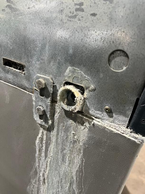 Scotsman ice machine, model CME256AS1H, showing corroded metal exterior and damaged vent detail. Used condition.