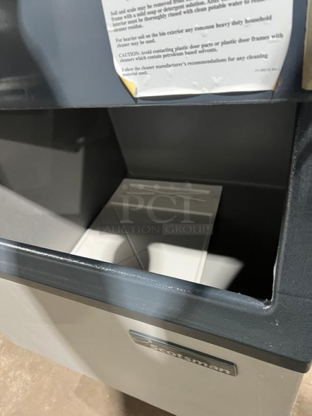 Scotsman CME256AS1H ice maker/bin combo, stainless steel, air-cooled, electric, on legs. Model/serial labels visible.