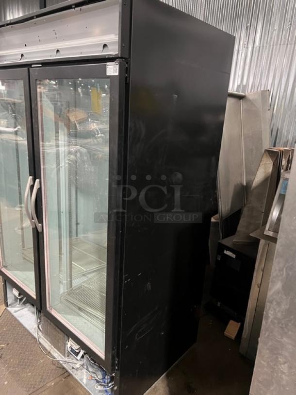Beverage-Air MarketMax black double glass door merchandiser refrigerator, model MMR49-1-B-LED-EL, with poly coated wire rack, in fair condition.