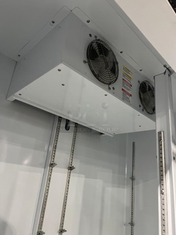 Beverage-Air MarketMax MMR49-1-B-LED-EL interior with fans, adjustable shelving tracks, poly-coated wire racks, 115V, SN: 11907816.