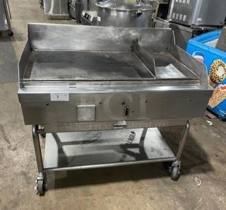 WoodStone stainless steel countertop split-top plancha griddle with back and side splash, on casters, model WSPL48364CT00NG, with single undershelf equipment stand.