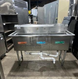 KCS commercial stainless steel 3-compartment dishwashing sink with backsplash, on legs, visible wash/rinse/sanitize labels.