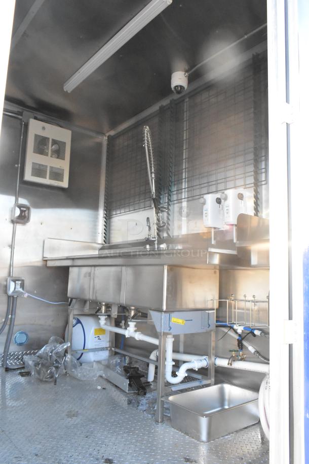 Brand new 2021 Cruising Kitchens 24' Burger King trailer interior with commercial sink, stainless fixtures, and grease hood.