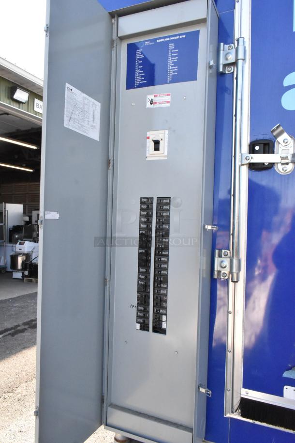 Electrical panel inside a 2021 Cruising Kitchens 24' Burger King fast food trailer, showing circuit breakers and wiring details.