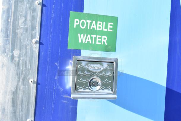 Alt text: "Potable water access labeled on Cruising Kitchens fast food trailer exterior."