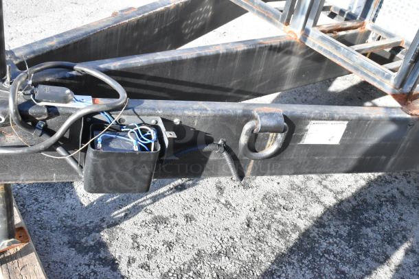 Trailer hitch area of a 2021 Cruising Kitchens 24' Burger King mobile kitchen, featuring wiring and a D-ring.