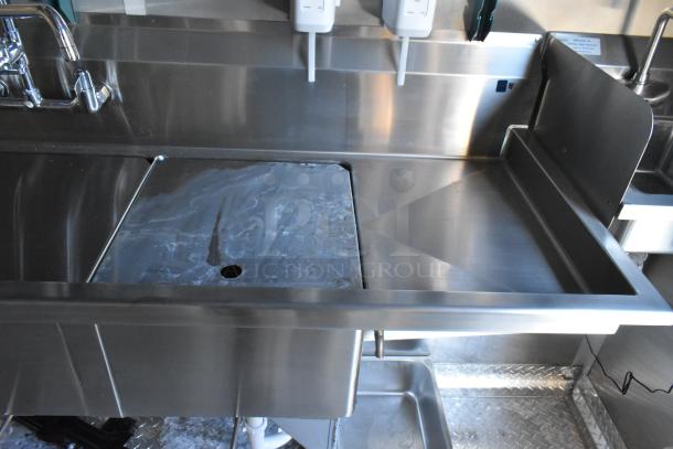 2021 Cruising Kitchens 24' Burger King fast food trailer interior with stainless steel sink and faucets. Brand new condition.