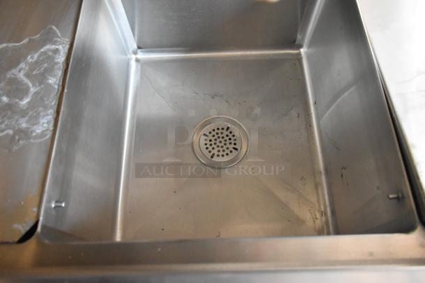 Stainless steel sink in a 2021 Cruising Kitchens Burger King mobile kitchen trailer, showcasing clean condition.