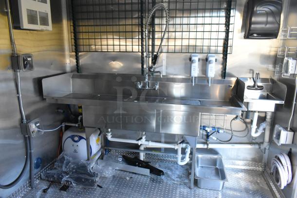 Brand new 2021 Cruising Kitchens 24' Burger King trailer interior, featuring a stainless steel sink, CaptiveAire hood, and fire suppression system.
