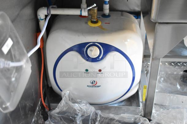 Ecotemp water heater installed in 2021 Burger King mobile kitchen trailer with piping and wiring visible.