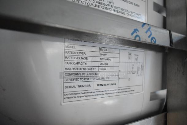 Label showing equipment specifications for a Cruising Kitchens 2021 fast food trailer. Model EM-7.0, rated power 1440W, 26L tank.