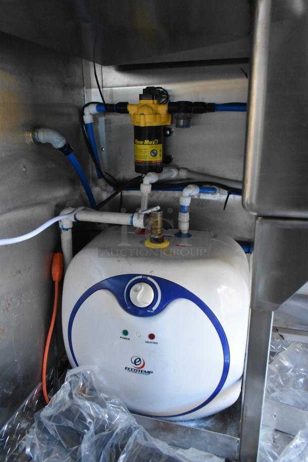 Inside view of a Cruising Kitchens 2021 Burger King mobile kitchen, showing new Eccotemp water heater and Flow Max filter, pristine condition.