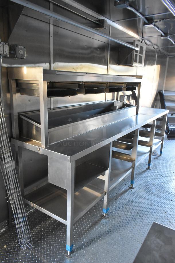 Brand new 2021 Cruising Kitchens 24' mobile kitchen interior, with CaptiveAire grease hood, fire suppression, stainless steel fixtures.