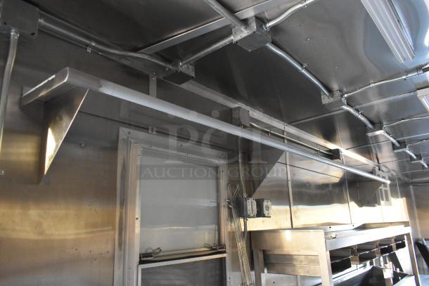Brand new 2021 Cruising Kitchens 24' Burger King fast food trailer interior with commercial-grade appliances and stainless steel finish.