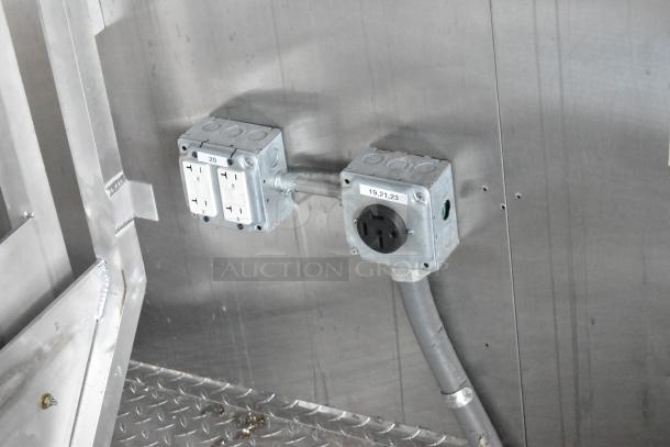 Electrical outlets inside the 2021 Cruising Kitchens 24' Burger King fast food trailer, showing power capabilities.