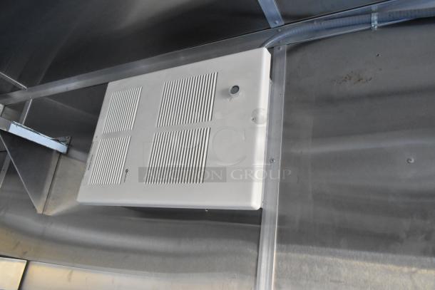 Interior of a 2021 Cruising Kitchens Burger King fast food trailer showing a wall-mounted exhaust vent.