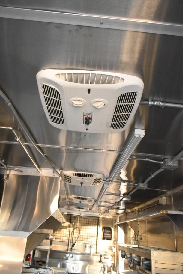 Brand new 2021 Cruising Kitchens 24' Burger King fast food trailer interior, featuring commercial CaptiveAire grease hood.