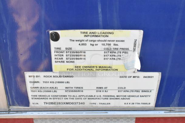 alt="Label showing tire and loading information for Rock Solid Cargo trailer, GVWR 7031 kg, manufactured April 2021."