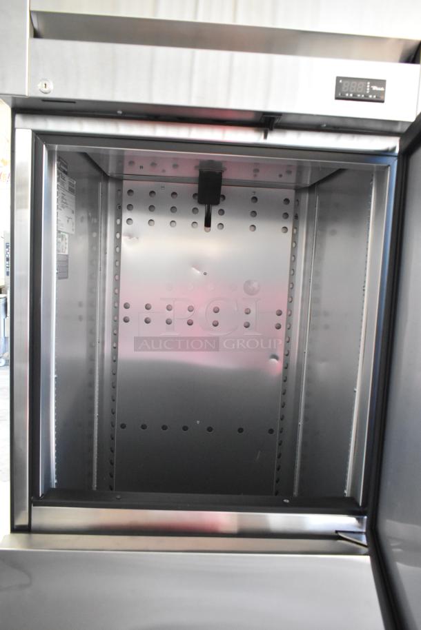 Brand new True T-23F-2-HC-MC commercial freezer, 2 half-size doors, visible scratch, poly-coated racks, 115V, 1 Phase.