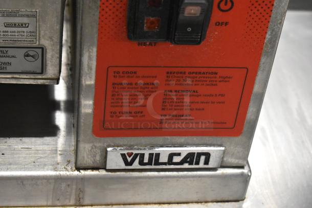 Vulcan steam table station with two 2016 K12ETT tilting electric steam jacketed kettles, 208/240V, 3/1 phase. Jasper instruction label visible.