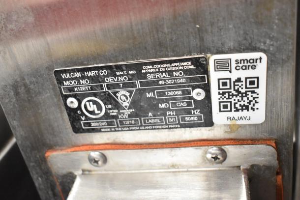 Label detail of Vulcan K12ETT electric steam kettles, showing model, serial number, voltage, and certification marks.