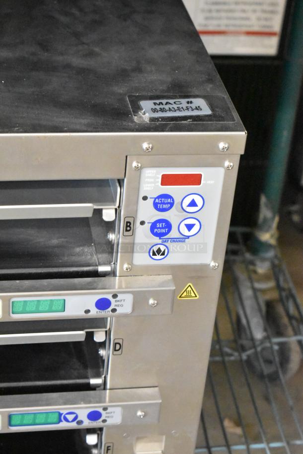 2021 Prince Castle EHB34-2, 3-shelf, 12-pan commercial holding bin, digital controls, visible label for model and MAC number.