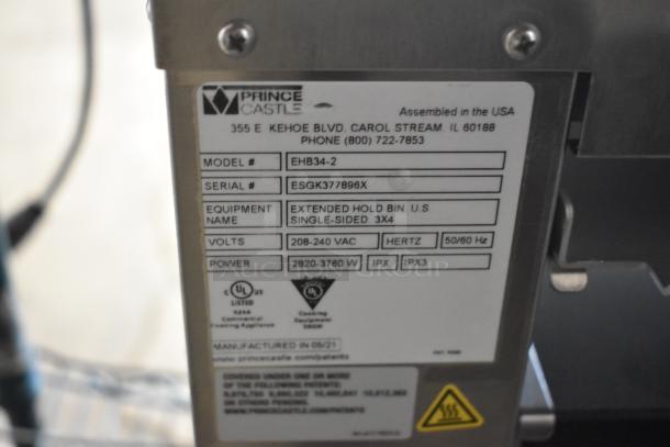 2021 Prince Castle EHB34-2 commercial holding bin label showing model, serial number, voltage, and manufacturing details.