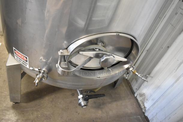 Stainless steel 8.75 BBL / 367-gallon beer determination tank, floor style, with handles and valve fixtures, in good condition.
