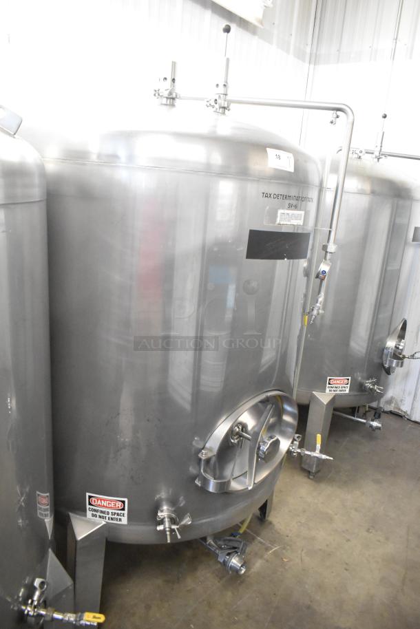 Stainless steel 8.75 BBL beer tax determination tank, 367 gallons, floor style, features labeling and safety markings.