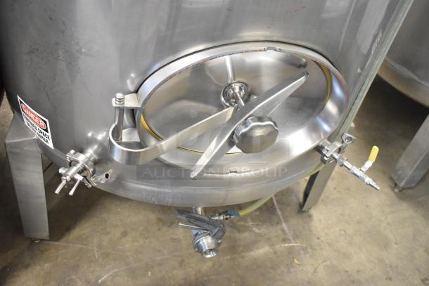 Stainless steel commercial 8.75 BBL beer tank, floor style, 367 gallons, with valve attachments, and danger label visible.