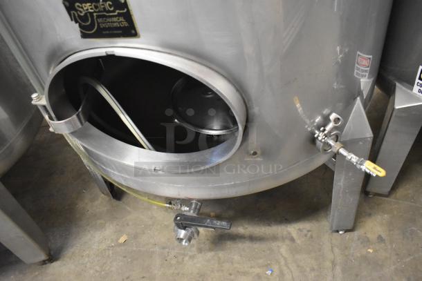 Stainless steel 8 BBL / 336 gallon beer tank with valve and hose fittings, door open for inspection, used condition.