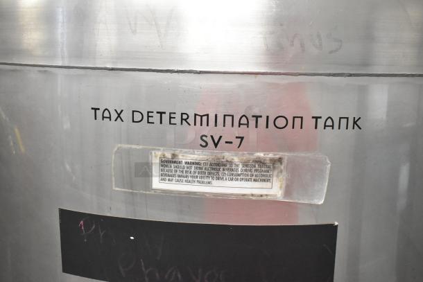 Stainless steel 8 BBL, 336-gallon tax determination tank with "SV-7" marking. Condition: used, warning label visible.