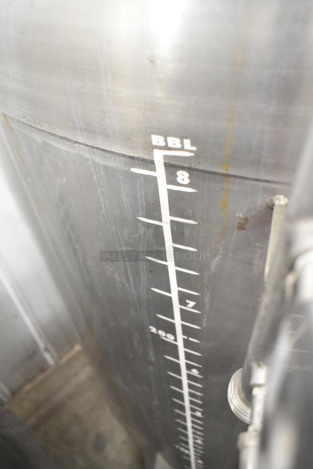Stainless steel 8 BBL beer tank, floor style, capacity markings visible, commercial use, excellent condition.