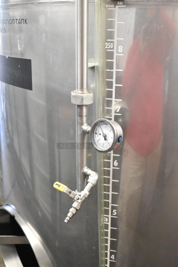 Stainless steel commercial floor-style 8.75 BBL beer tank with gauge, valve, and capacity markings. In excellent condition.