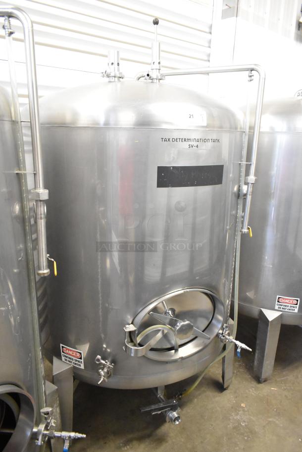 Stainless steel commercial beer tank, 8.75 BBL capacity, labeled "Tax Determination Tank SV-4," with safety notice and piping.