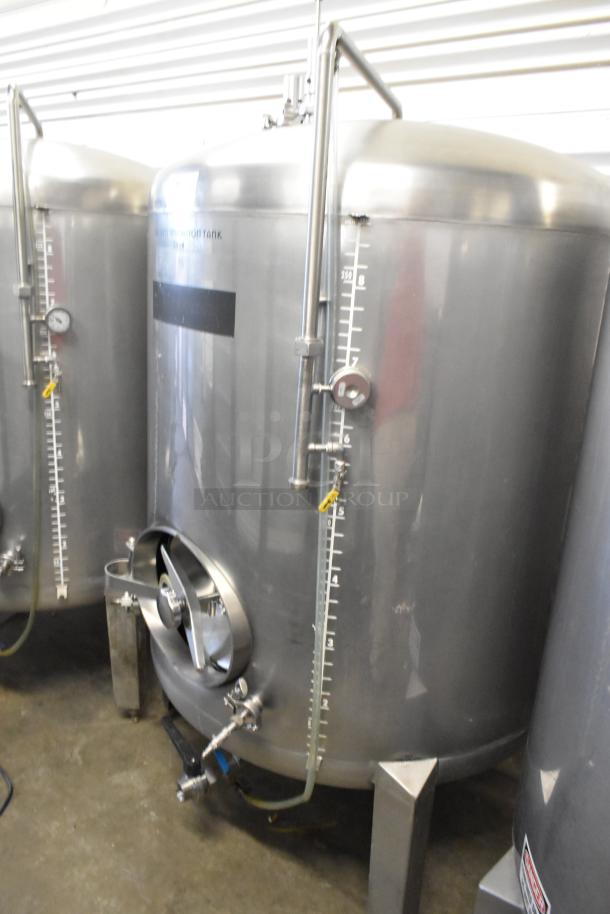 Stainless steel 8.75 BBL/367 Gallon beer tank with tax determination markings, floor style, gauge, and valve, in good condition.