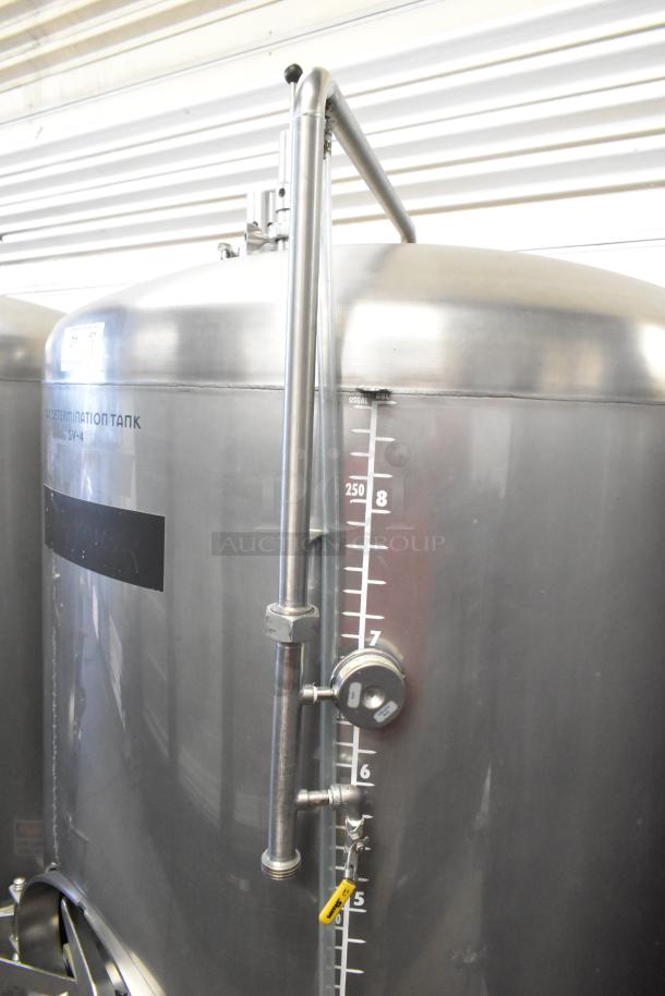Stainless steel 8.75 BBL / 367-gallon beer tax determination tank. Features gauge markings, hose connections, and secure fittings.