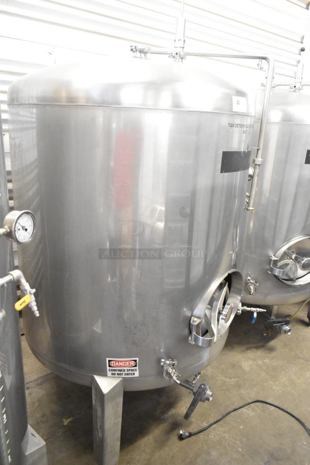 Stainless steel commercial 8.75 BBL beer tank, 367 gallons, with gauges and valves, labeled "Tax Determination" and "Danger."