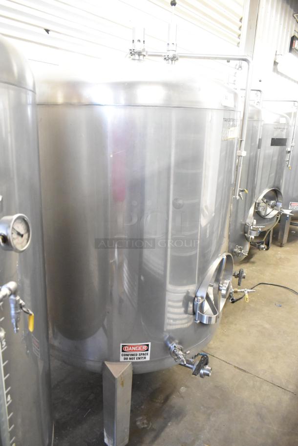 Stainless steel 8.75 BBL / 367 Gallon beer tank with gauges and safety labels, in excellent condition.