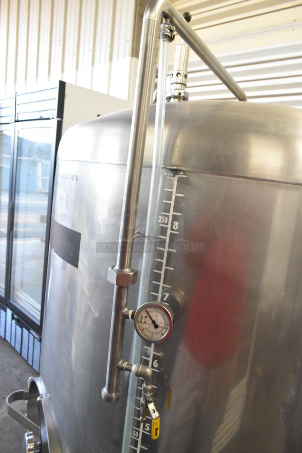 Stainless steel 8.75 BBL/367-gallon beer tank, features gauge and markings, in excellent condition for commercial use.