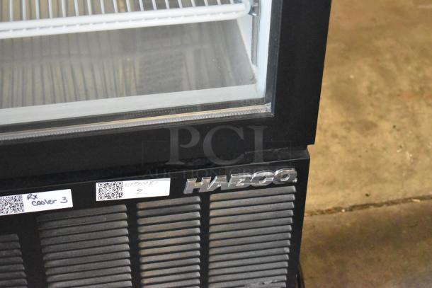 Habco SE12 metal commercial cooler with single glass door and poly-coated racks. Visible Habco logo and condition labels.