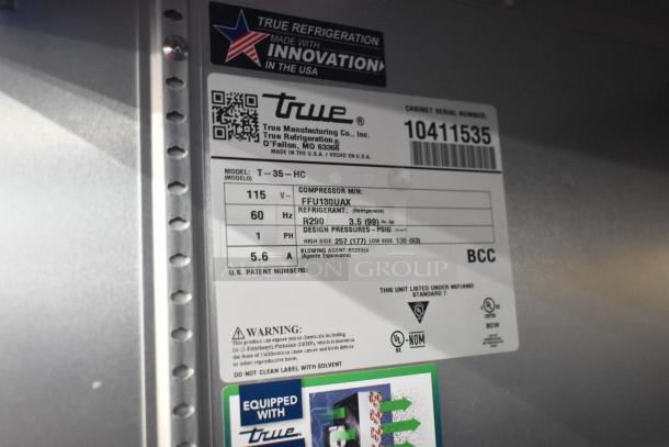 2022 True T-35-HC Commercial 2 Door Cooler label showing model, voltage, and refrigerant details.