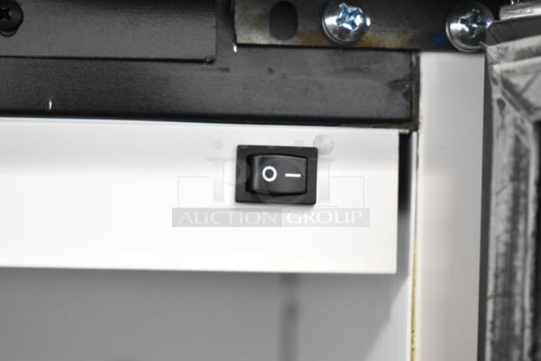 On/off switch inside a 2019 Habco SE18 Commercial Reach In Cooler Merchandiser. Poly coated racks, 115V, 1 Phase.